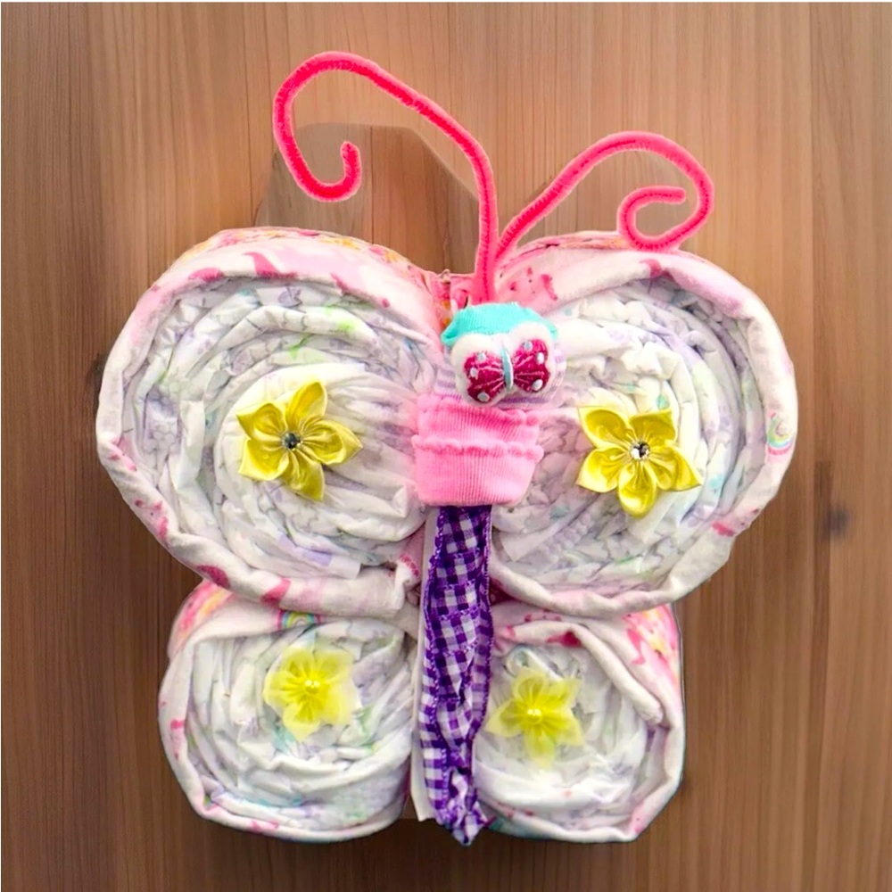 Enchanting Butterfly Cutie Diaper Cake, a delightful & eye-catching centerpiece